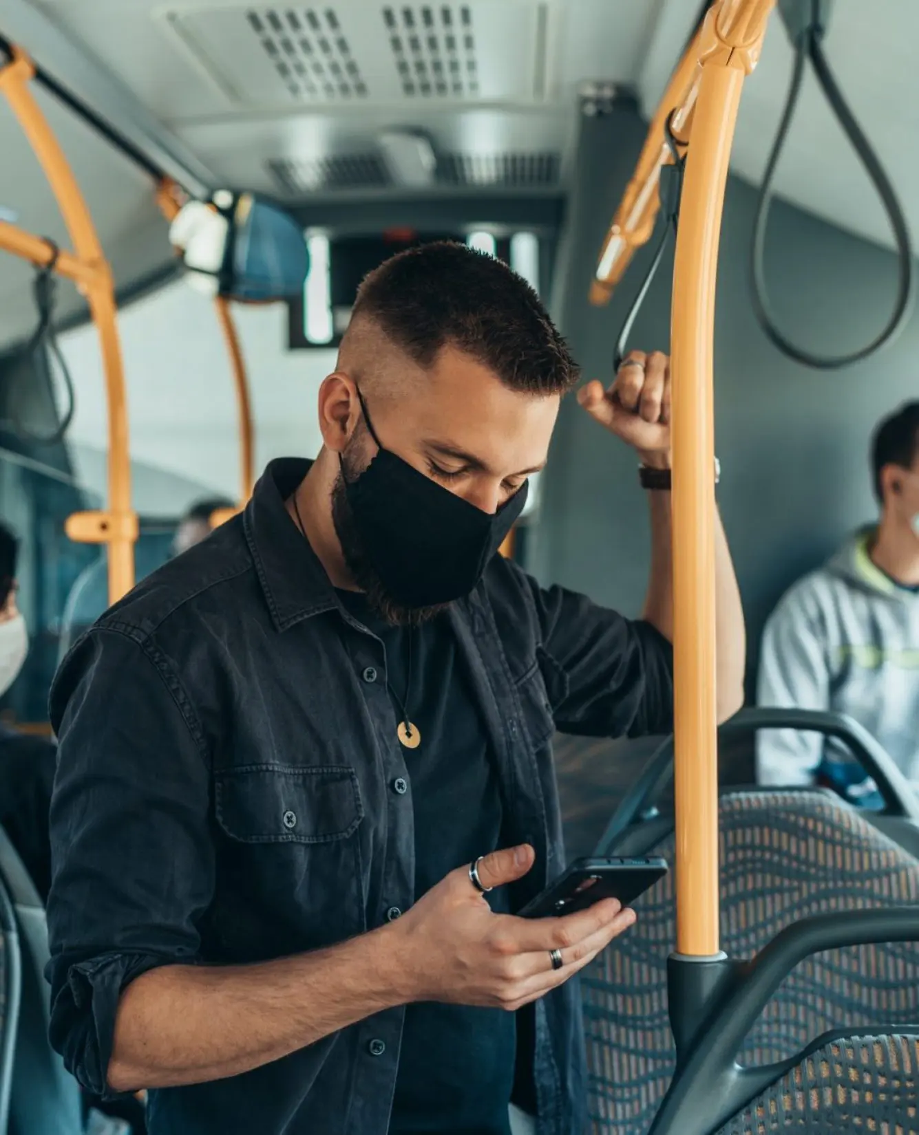 Man Wearing A Protective Mask And Using A Smartphone While Keeping The Distance In The Bus E1656575430517 Pr2f07o1sngdbqks1z18uffnc9vfwzb07yt4x13gok